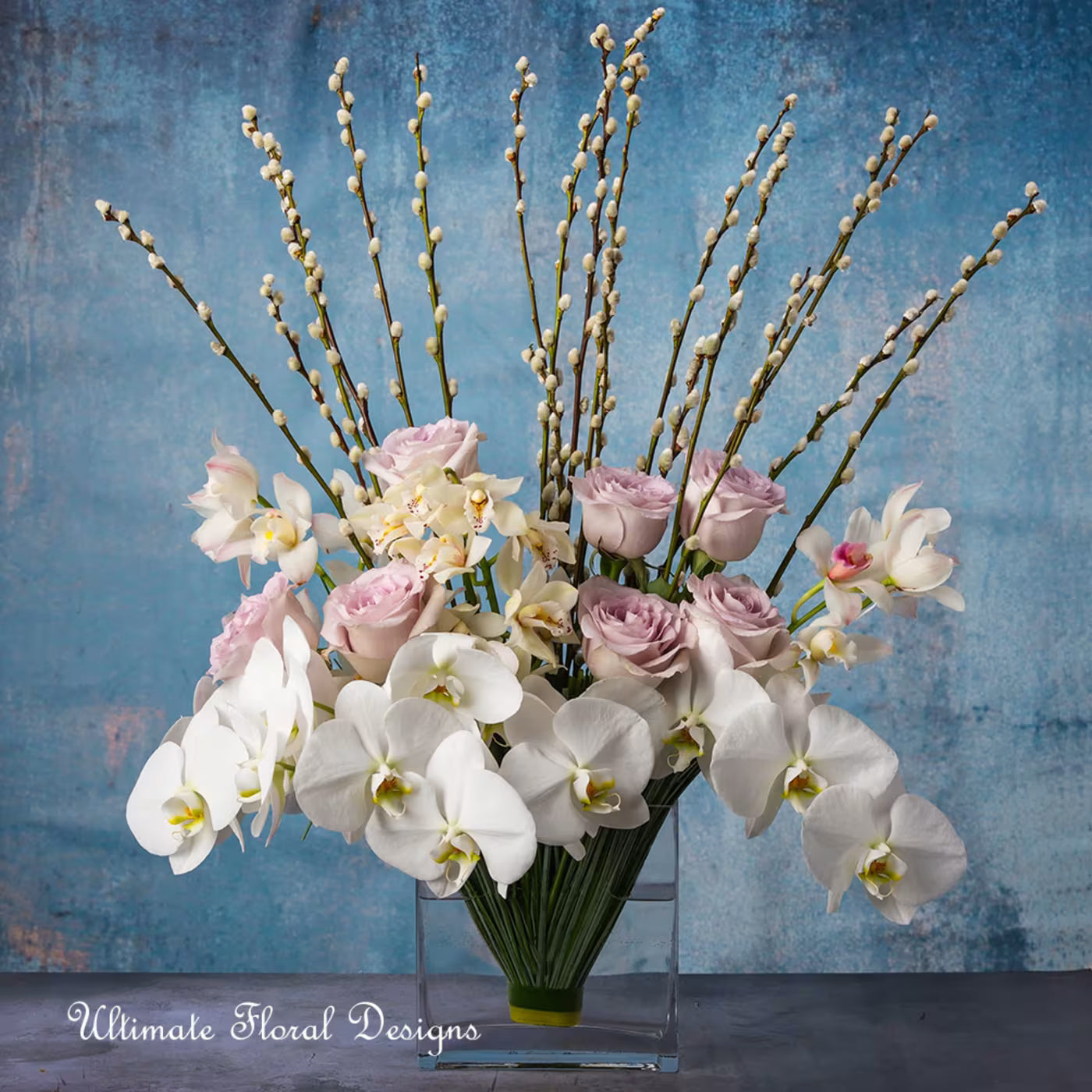 white orchids and pink roses, pussy willow in a clear -Ultimate Floral Designs Great Falls VA