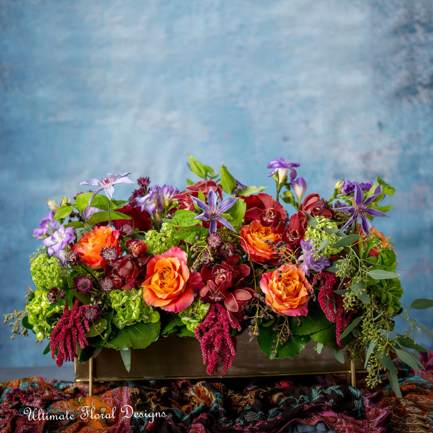 rectangular arrangement with jasmine vine, hydrangea , orchids, freesia, viburnum-ultimate floral designs Great Falls Va