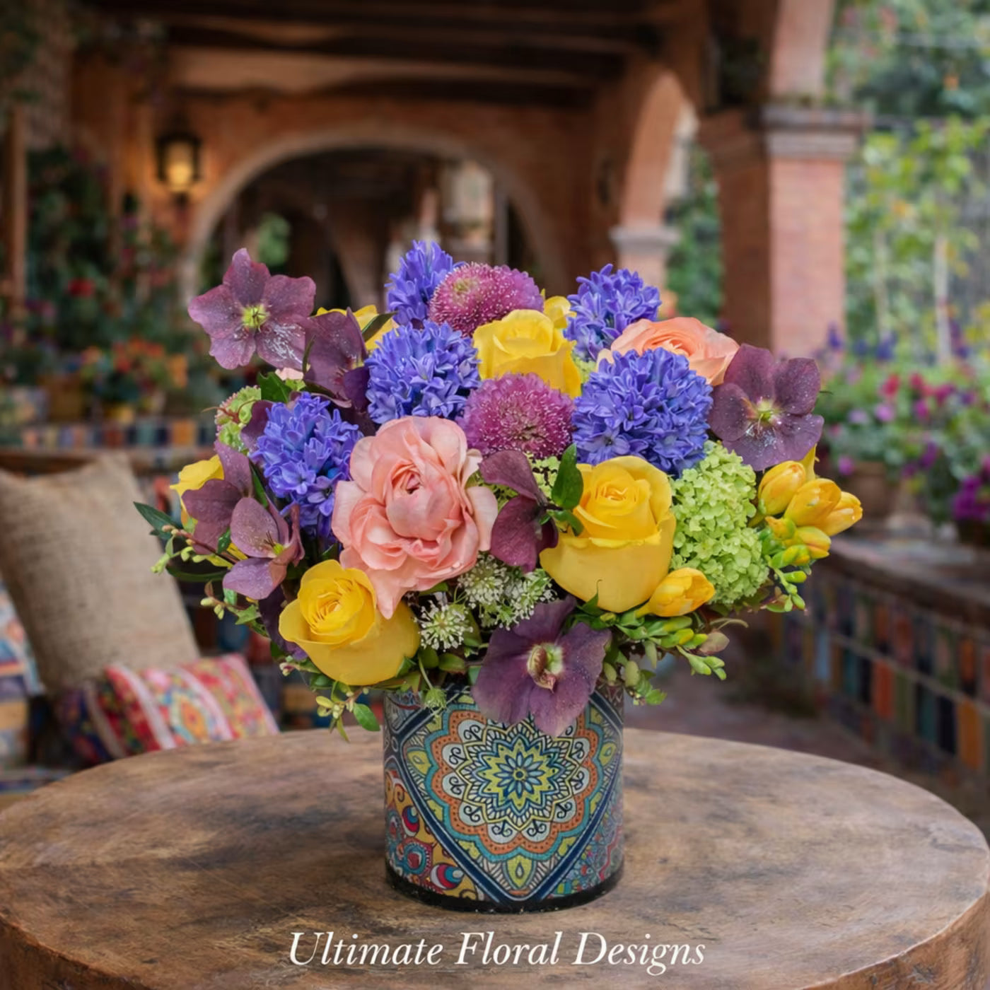 Roses, hyacinths, and hellebores in a vibrant European garden-style arrangement — Ultimate Floral Designs, Great Falls, VA
